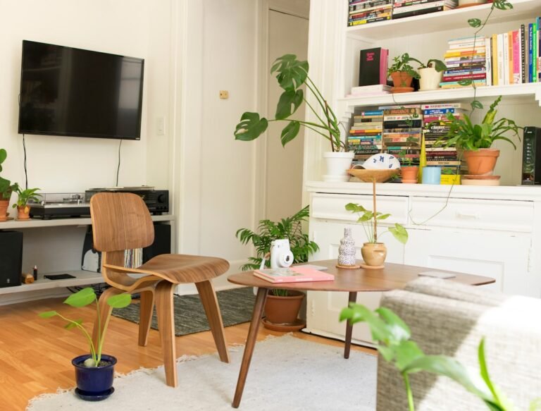 Cozy small apartment living room filled with plants and personality
