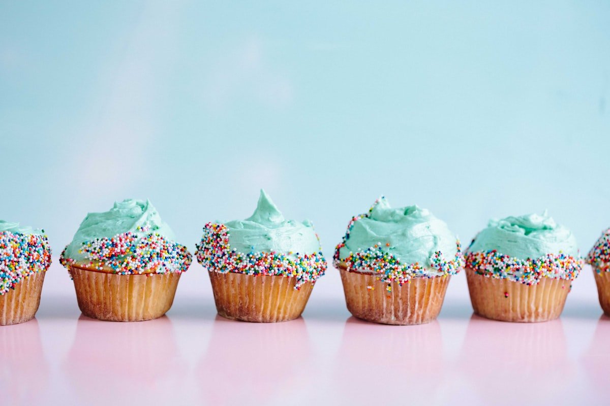 Frosted cupcakes with sprinkles at a decorating party