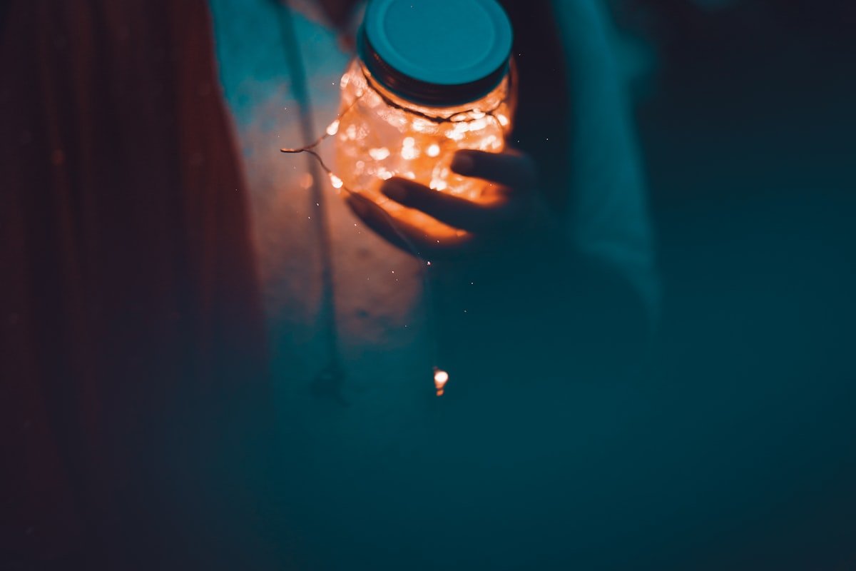 Mason jar glowing with warm fairy lights