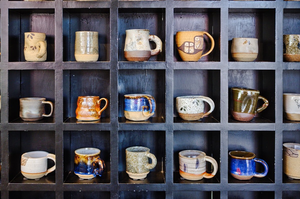 Cozy mugs displayed on open shelving