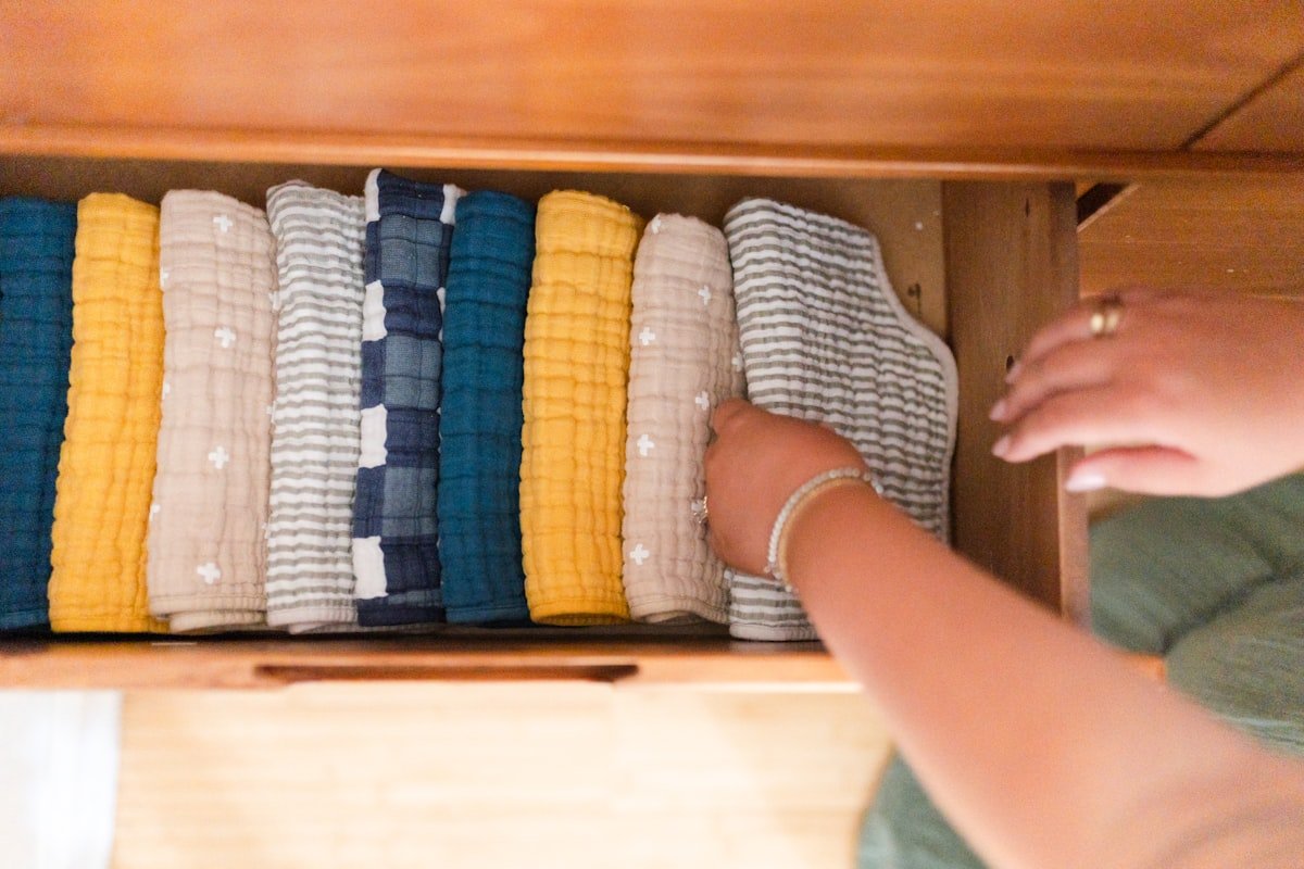 Clothes rolled and file-folded in a drawer so every item is visible