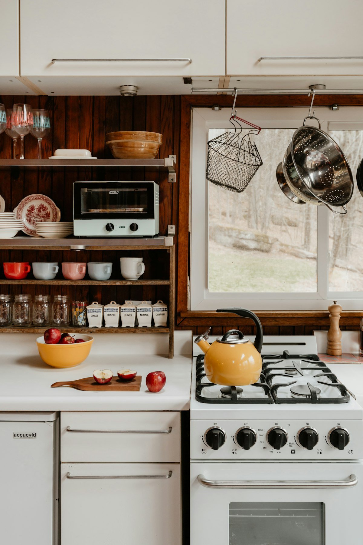 Favorite mugs stored on cozy open kitchen shelving