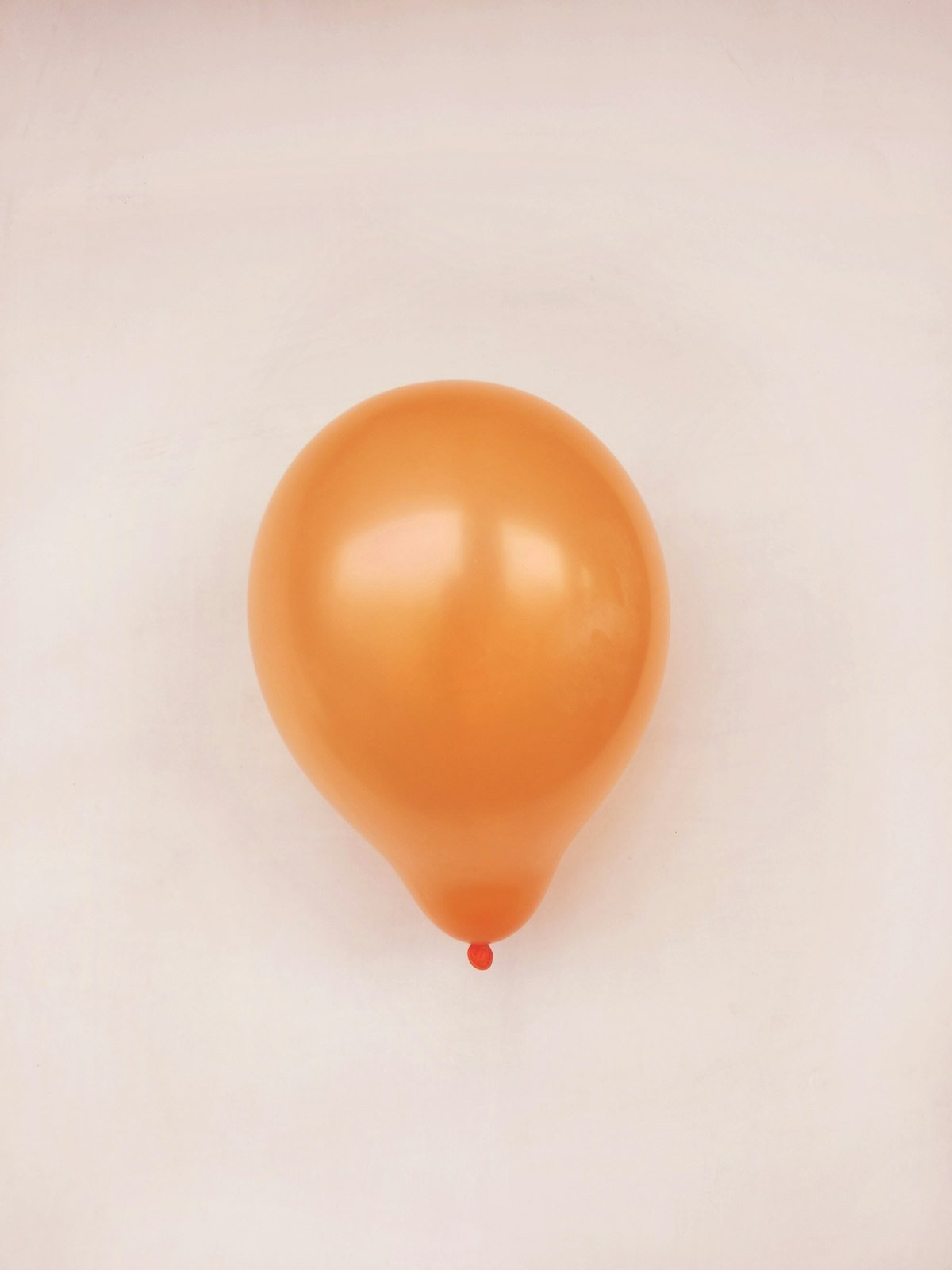 Orange balloon for a DIY pumpkin balloon arch