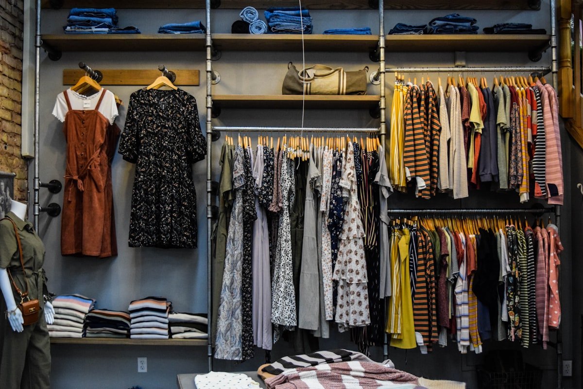 Fully organized closet with shelves and hanging clothes after a declutter
