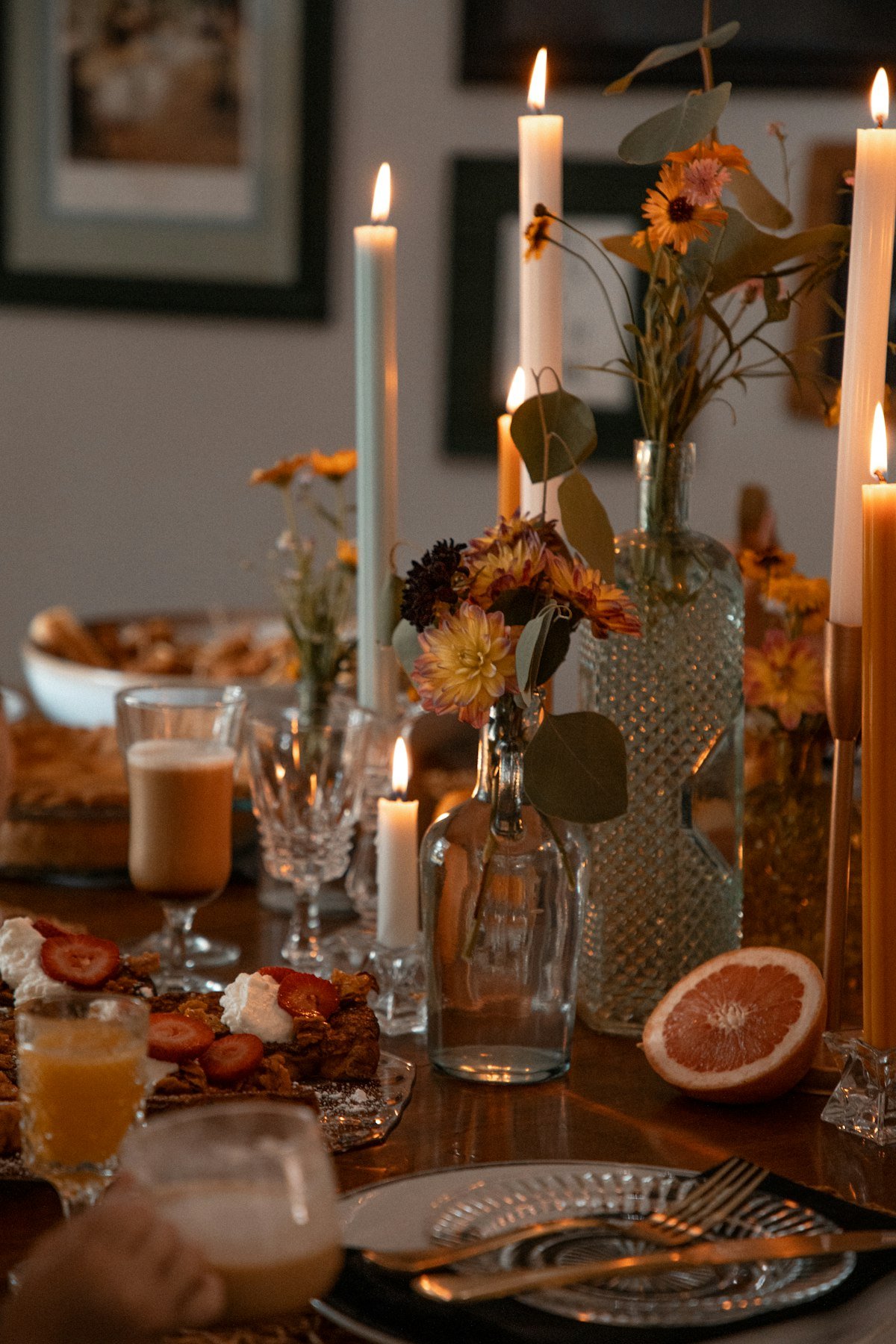 Dinner table set the night before with candles and flowers