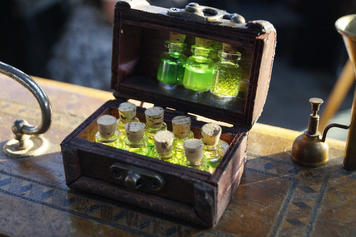 Green witch potion bottles in a wooden chest