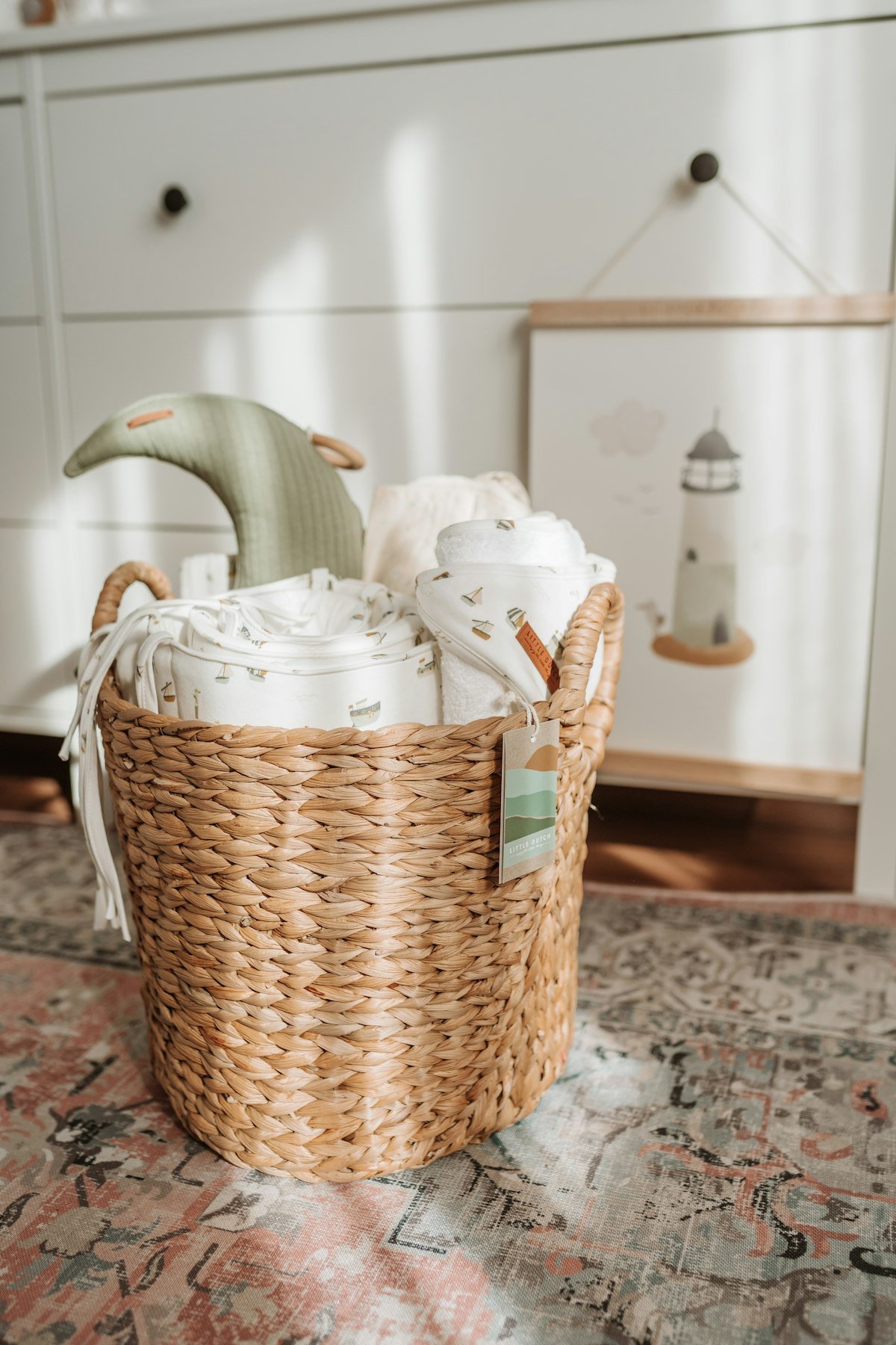 Woven basket holding folded cozy blankets